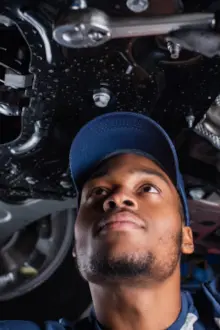 mechanic under a car